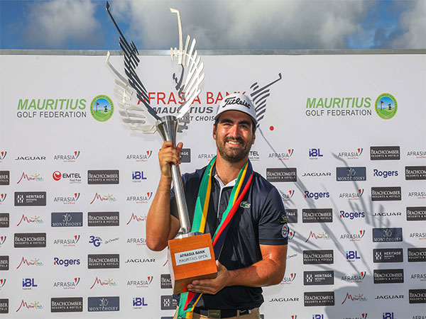 Antoine Rozner lifting Mauritius Open trophy (Image: PGA)