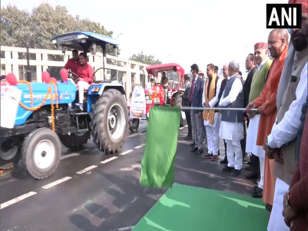 Uttar Pradesh Chief Minister Yogi Adityanath flagging off tractors. (Photo/ANI)