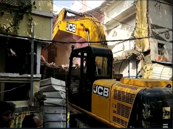 Illegal construction being bulldozed (Photo/ANI)