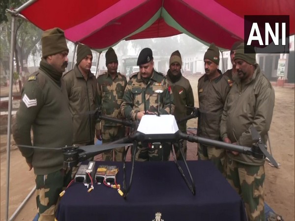 BSF troops with a Pak drone that was shot down. (Photo/ANI)