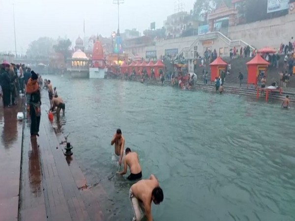 Devotees take a dip in the holy Ganges. (Photo/ANI)