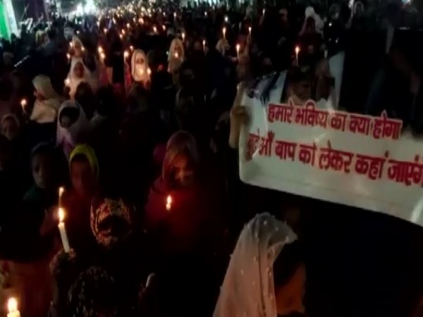 Protestors carrying out candle march in Haldwani (Photo/ANI)