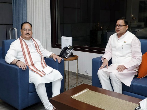 Uttarakhand CM Pushkar Singh Dhami and BJP National President JP Nadda (ANI File Photo/Yogi Adityanath Twitter)