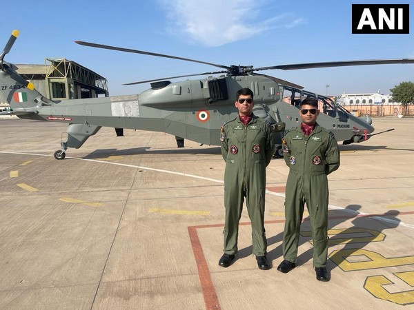 IAF attack helicopter pilots Squadron Leaders Tanmai Manan and Raunak Dubey with Prachand chopper (Photo: ANI)