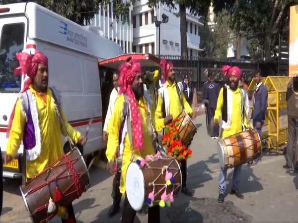 Artists beating drums in Delhi's Patel Chowk ahead of PM's roadshow (Photo/ANI)