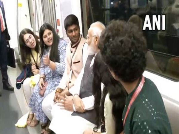 Prime Minister Narendra Modi interacting with students during ride in Mumbai metro