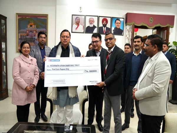 Country Head of HDFC Bank Akhilesh Kumar Rai presented a check of Rs 5 crore to Chief Minister Pushkar Singh Dhami for the Kedarnath Utthan Charitable Trust (Photo/ANI)