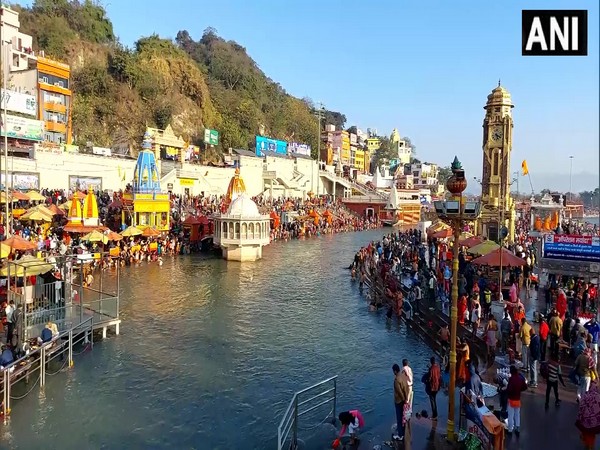 Visual of devotees taking dip in river Ganga in Haridwar (ANI Photo)