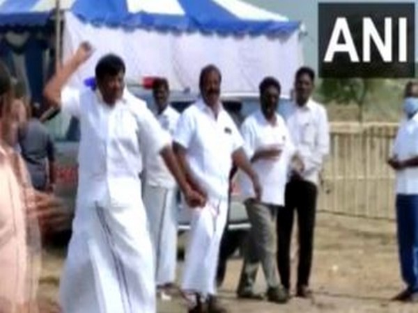 A purported visual of DMK leader SM Nazar throwing a stone at party workers. (Photo/ANI)