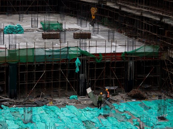 Workers work at a construction site in Beijing. (Photo Credit - Reuters)