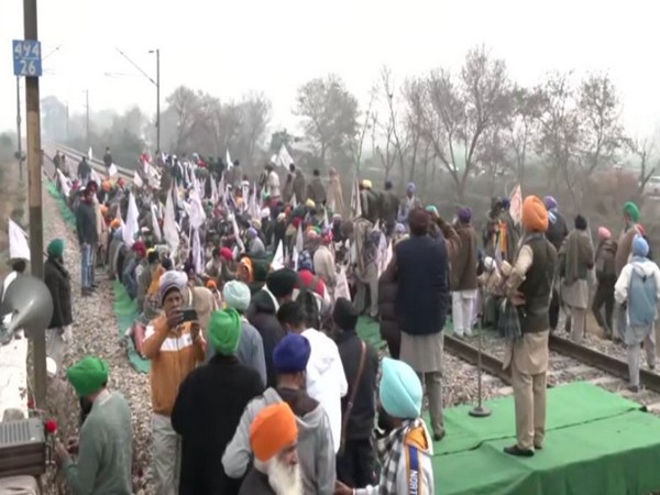 Farmers stage protest by blocking the railway track on Batala railway station (Photo/ANI)