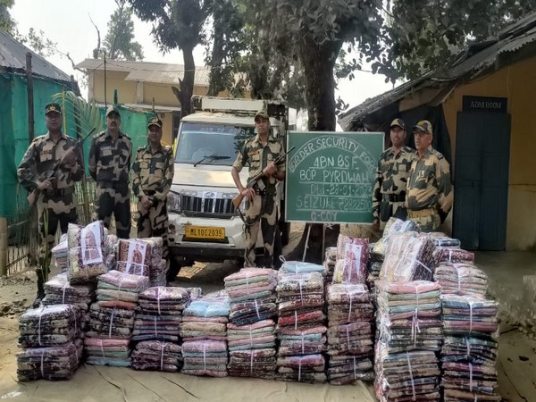 The BSF troops with the seized items. (Photo/ANI)