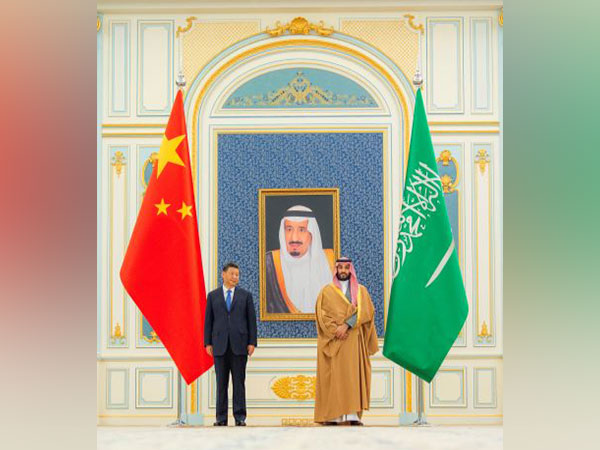 Saudi Crown Prince Mohammed Bin Salman stands with Chinese President Xi Jinping in Riyadh. (Photo Credit -Reuters)