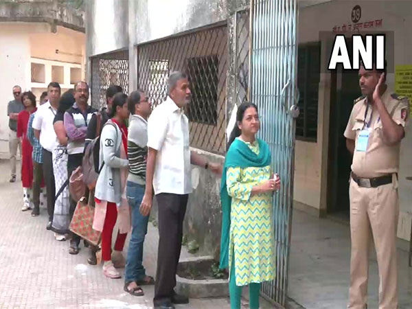 People waiting in line to vote for the Nagpur Division Teacher Constituency. (Photo/ANI)