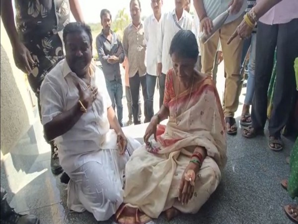 Nandipet Sarpanch and her husband staging protest outside Nizamabad Collectorate (Photo/ANI)
