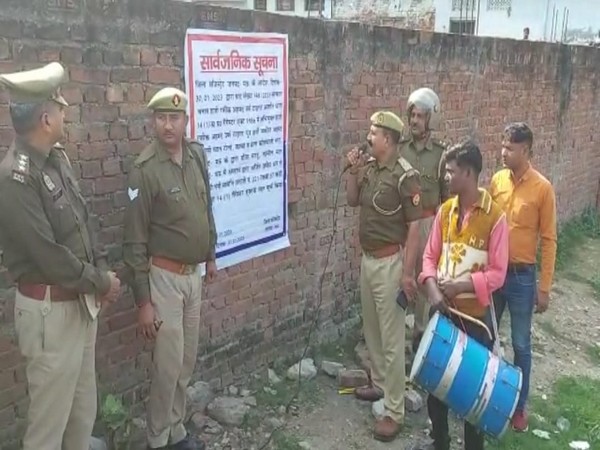 The authorities in Mau district with the order of the District Magistrate at one of the properties of Haji Rafiq Ahmad (Photo/ANI)