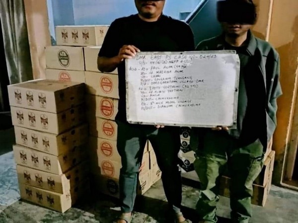 Two arrested accused with seized alcohol (Photo/ANI)