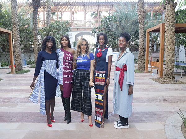 Senator, Dr Rasha Kelej, CEO of Merck Foundation with designs displaying designs to STOP FGM