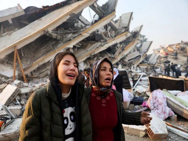 Women react near rubble following an earthquake in Hatay, Turkey. (Photo Credit - Reuters)