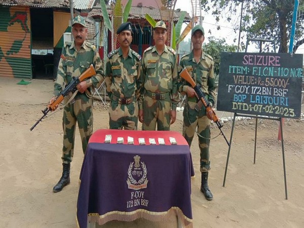 BSF personnel with seized fake currency notes (Photo/ANI)