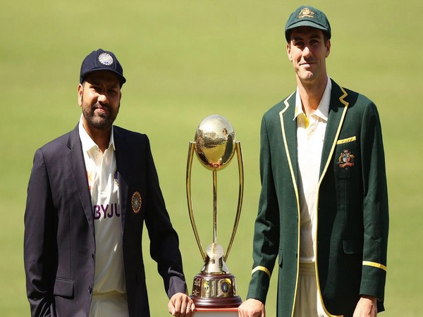 Rohit Sharma and Pat Cummins with the trophy. (Photo- ICC)
