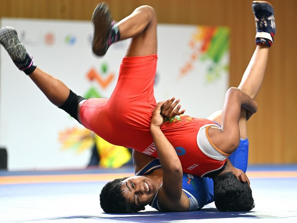 Wrestler Samruddhi (In Blue jersey) in action during Khelo India Youth Games 2022 (Image: MYAS/SAI media)