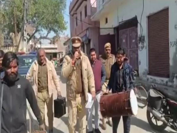 Police making public announcement before sealing the property. (Photo/ANI)