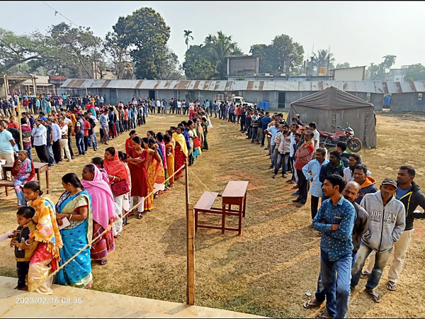 Voters wait in the queue to cast their votes at the polling booth for the Tripura Assembly Elections 2023, on Thursday. (ANI /Photo)
