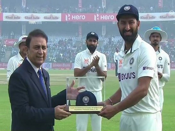 Cheteshwar Pujara receiving his 100th Test cap from Sunil Gavaskar. (Photo- VVS Laxman Twitter)