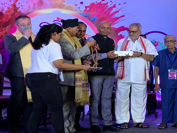 Odisha Governor Ganeshi Lal handing over the award to Abhay K (Photo/ANI)