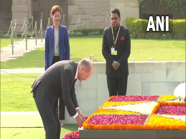 German Chancellor Olaf Scholz lays wreath at Mahatma Gandhi memorial at Rajghat (Photo/ANI)