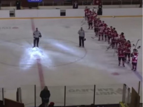 Screengrab of players of Hong Kong's ice hockey team making a time-out gesture as protest song 'Glory to Hong Kong' was played after their victory against Iran. (Image credit: Twitter)