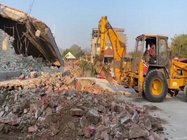 Illegal portions of suspended ASP's farmhouse being removed (Photo/ANI)