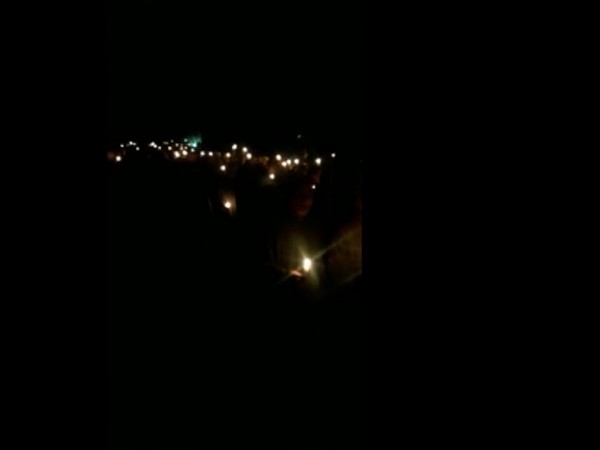 Residents in Pulwama take out a candlelight protest. (Photo/ANI)