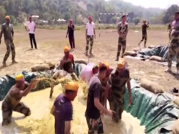 BSF Jawans playing in a makeshift mud pit at Indo-Bangladesh border (Photo/ANI)
