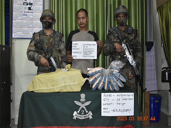 The Aizawl Battalion of 23 Sector Assam Rifles with the seized items and apprehended person (ANI)