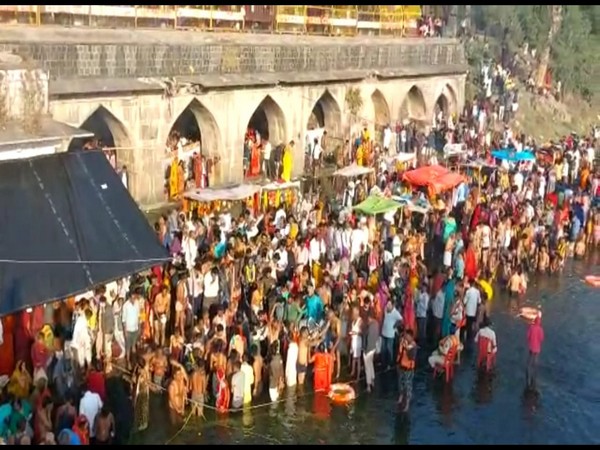 Devotees taking holy dip (Photo/ANI)