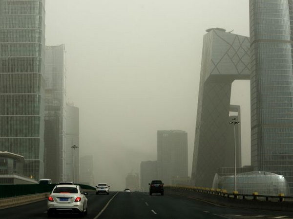 A general view of buildings shrouded in smog amid a sandstorm, at Beijing's Central Business District (CBD) in Beijing. (Photo Credit - Reuters)