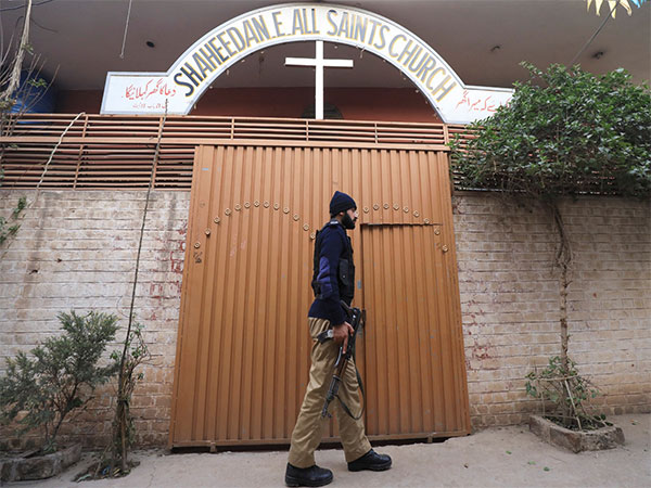 A police officer walks in front of the Shaheedan-e-All Saints Church in Pakistan's Peshawar. (File Photo/Reuters)