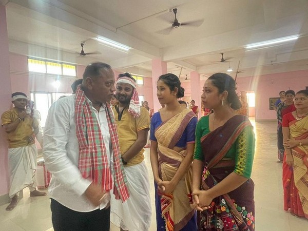 Transport, Excise and Fisheries Minister Parimal Suklabaidya with Bihu dancers. (File photo/ANI)
