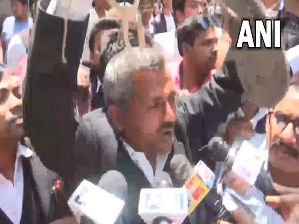 Man holding garland of footwear to greet Atiq Ahmed (Photo/ANI)