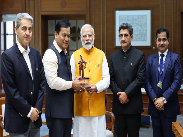 The 'First Merchant Navy Flag' was pinned on the lapel of Prime Minister Narendra Modi. (Photo/ANI)