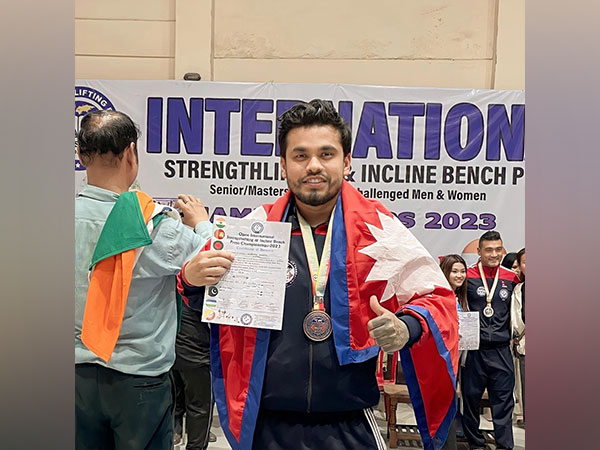 Deepak Khadka poses for a photo along with the certificate and medal after winning the championship. (Photo Credit: Deepak Khadka)