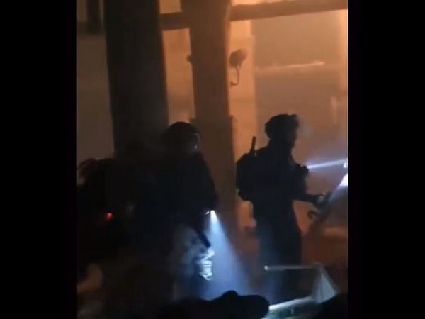 Screengrab of a video showing the Israeli police storming in Al-Aqsa mosque in Jerusalem on Wednesday. (Image Credit: Twitter/@PalMissionUK)