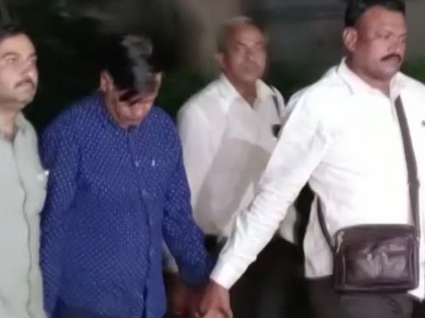 Kiran patel brought to Ahmedabad (Photo/ANI)