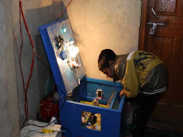 Momin Ishaq with his low-cost egg incubator. (Photo/ANI)
