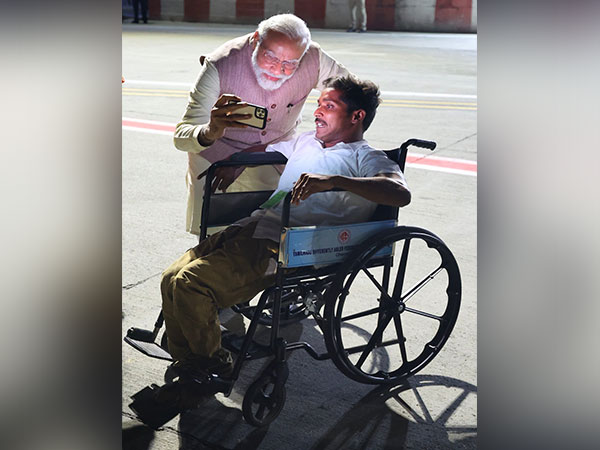 Prime Minister Narendra Modi takes selfie with BJP worker (Photo/ Narendra Modi Twitter)