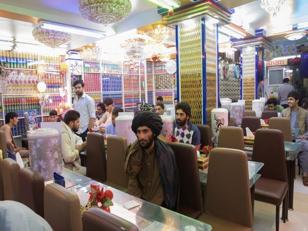 Afghan men are seen in a restaurant in Herat. (Photo Credit - Reuters)