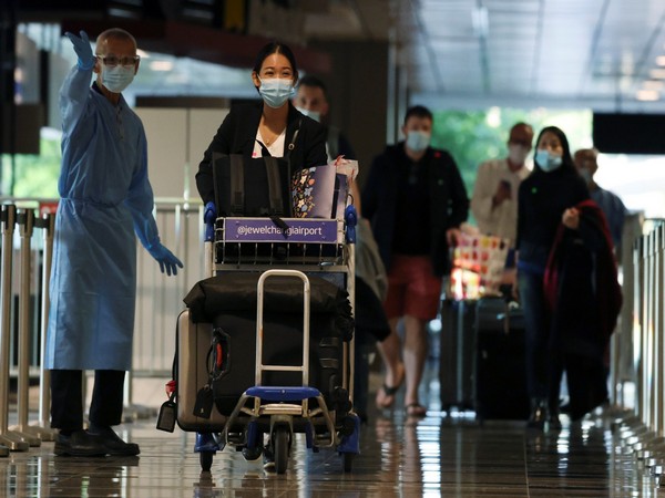 Visitors arriving in Singapore (Image Credit: Reuters)