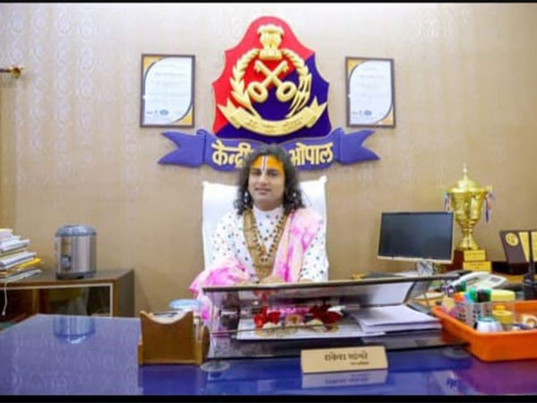 Storyteller Aniruddh Acharya sitting in chair of Bhopal Central Jail Superintendent